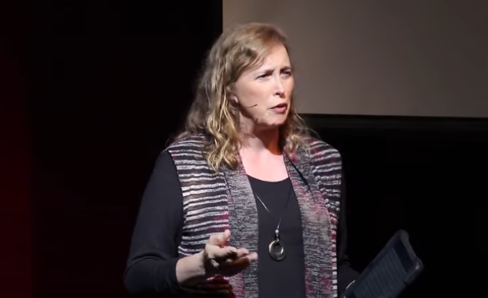 Susanne Coates giving a TED-x Talk in 2019