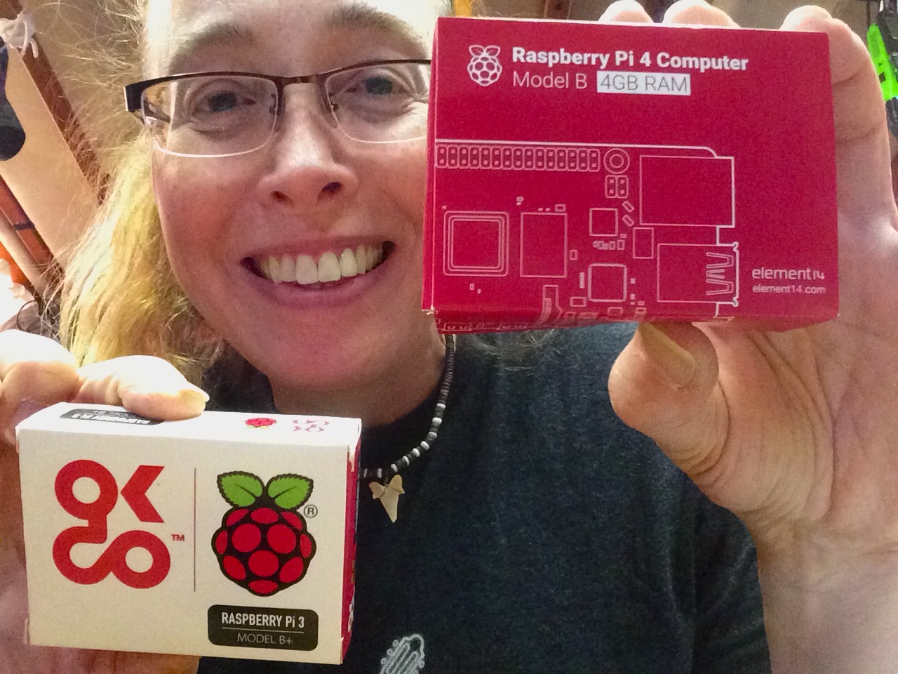 Susanne holding Raspberry pi 3 and 4
